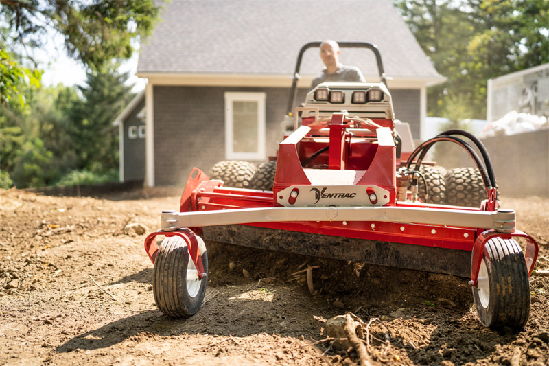 A Ventrac with a Power Rake attachment