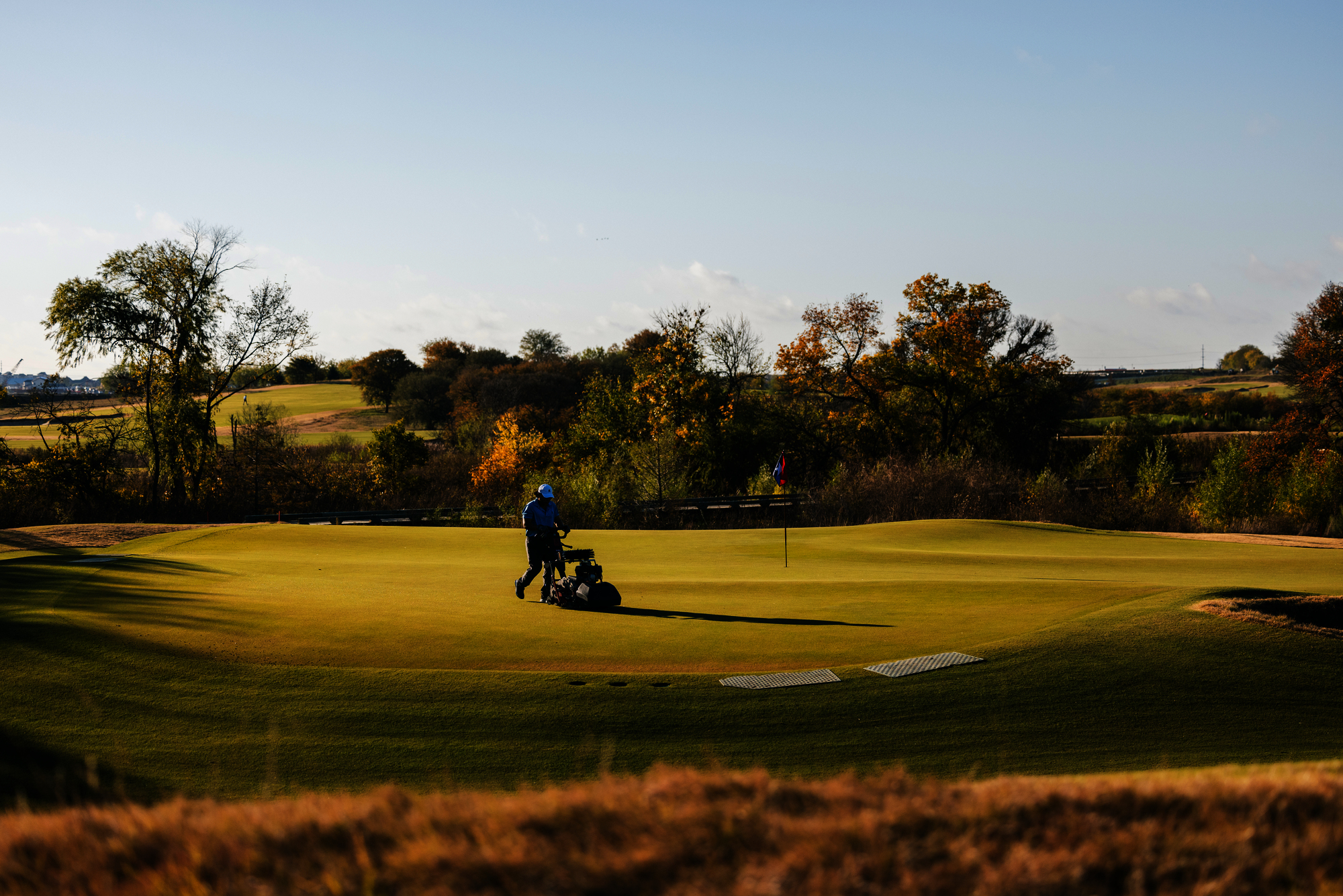 A Toro Greensmaster on a golf green at Sunset